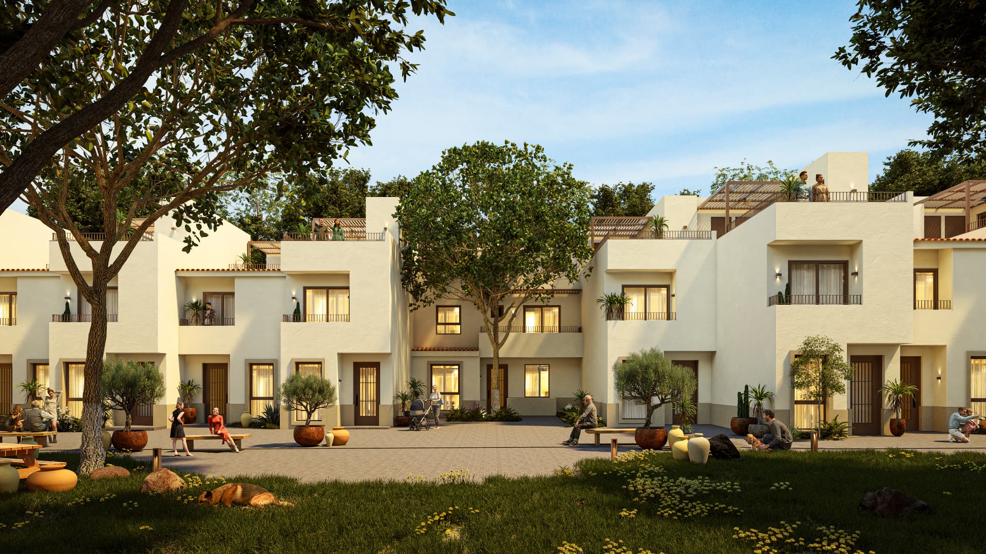 Vista del patio central de Nogalia con villas, jardines y áreas comunes